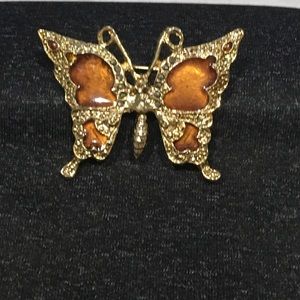 Gold tone and amber butterfly brooch with black rhinestones.